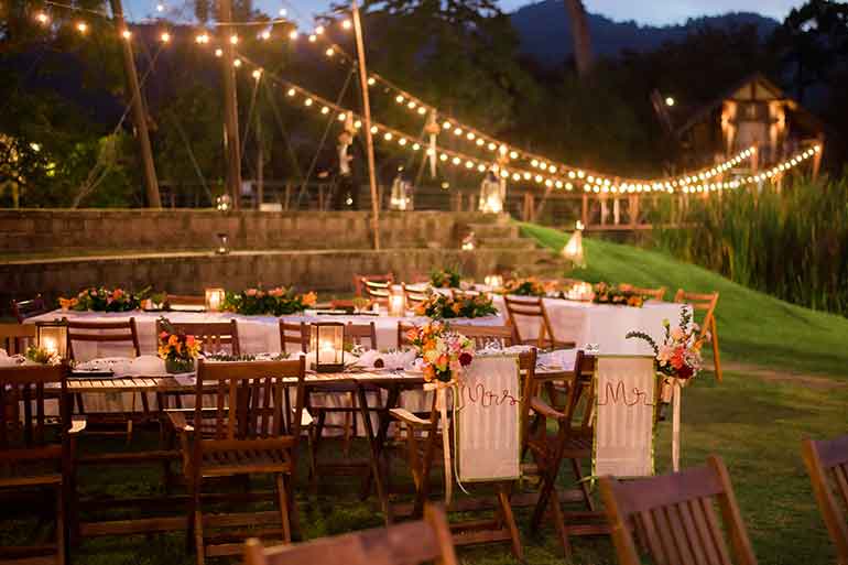 Backyard garden party with table and fairy lights