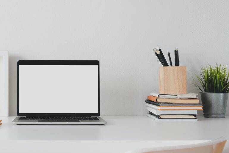 Macbook pro on a white desk