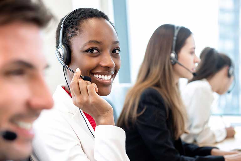 Woman in call centre weaing headset