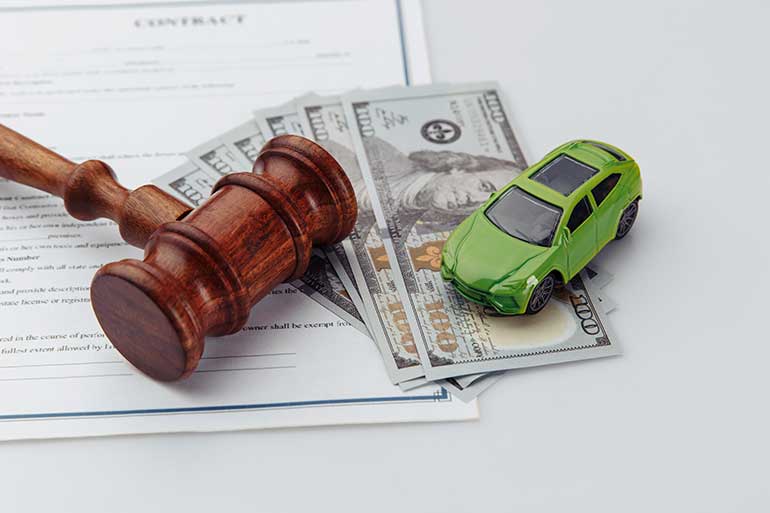 Gavel, money and toy car