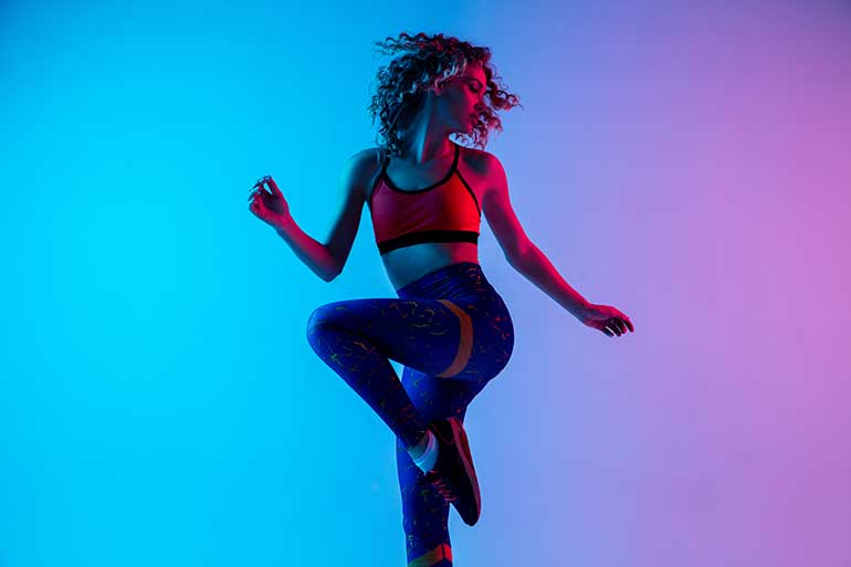 https://cdn.flippingheck.com/wp-content/uploads/2021/12/woman-wearing-fitness-gear-and-jumping-for-joy.jpeg