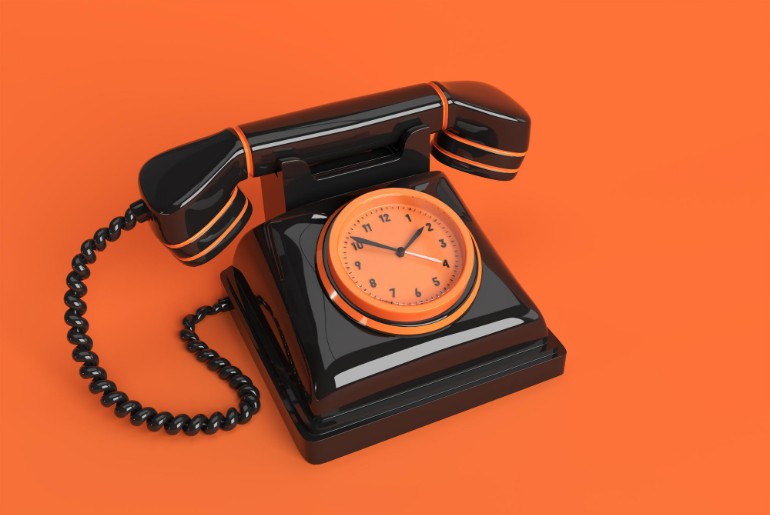 Rotary phone on an orange background