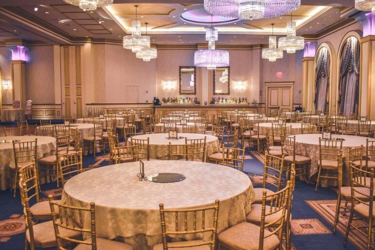 Large event space with round dining tables set up