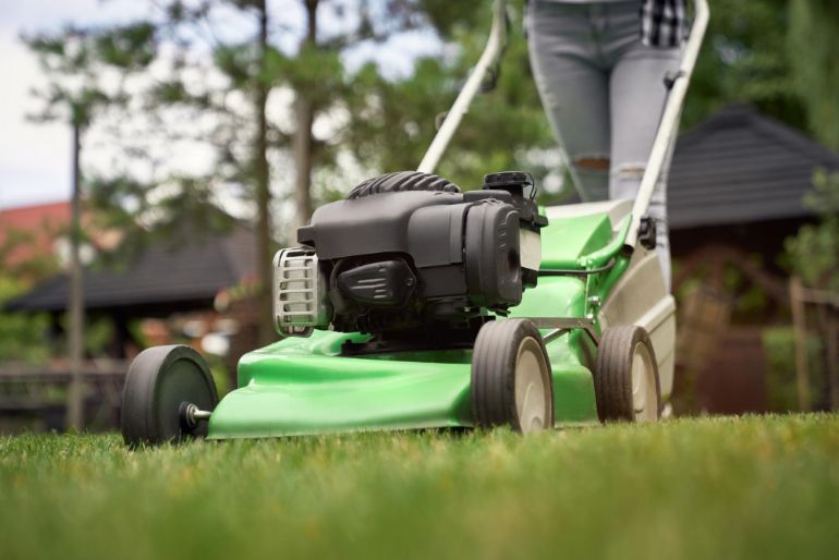Person mowing a lawn