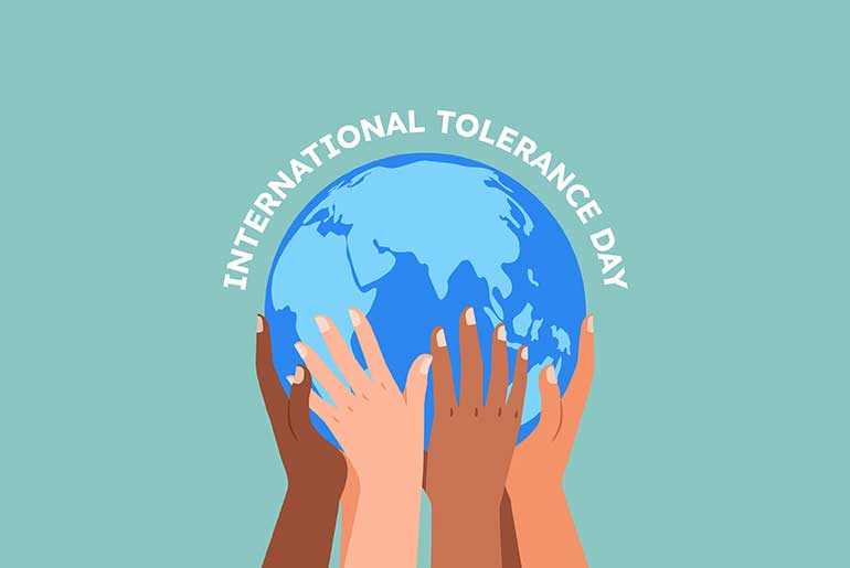 Illustration of hands of various skin tones holding up a globe under the words international tolerance day