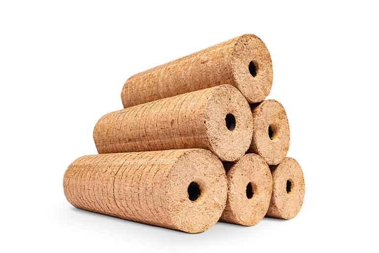 A stack of hardwood heat logs against a white background