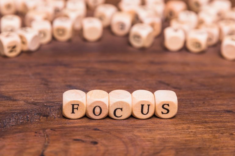 Wooden block spelling out the word "Focus"