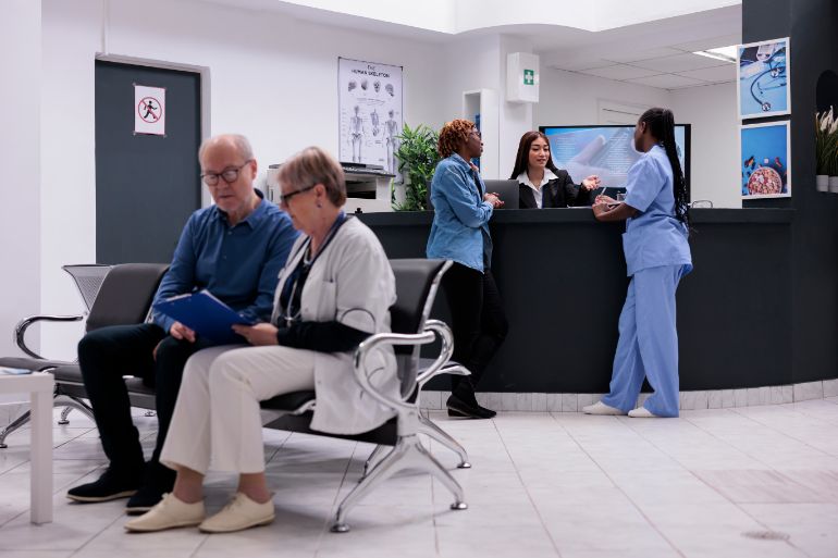 Patients sitting in a medical centre reception area