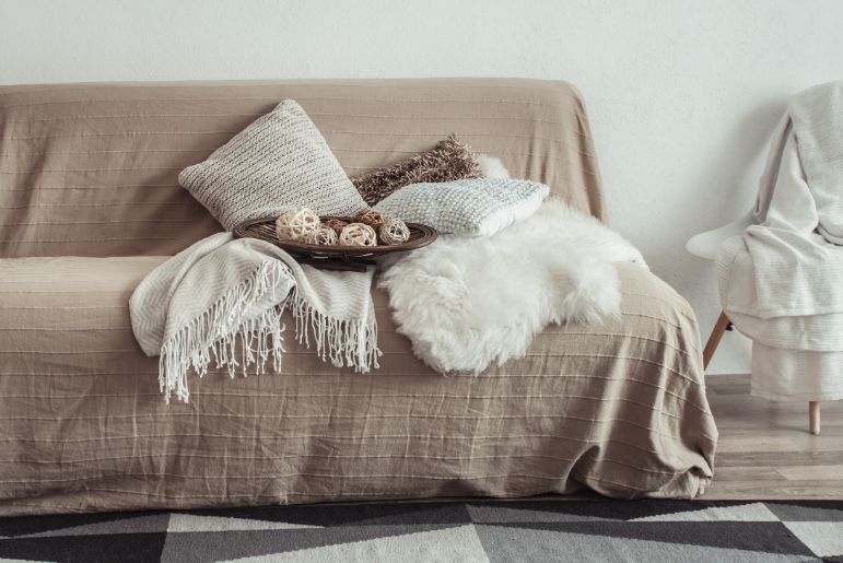 A variety of fabrics covering a couch